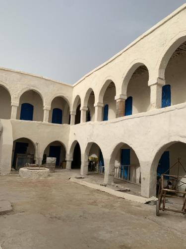 a large building with many arches on it at Dar Lola Djerba in Houmt Souk