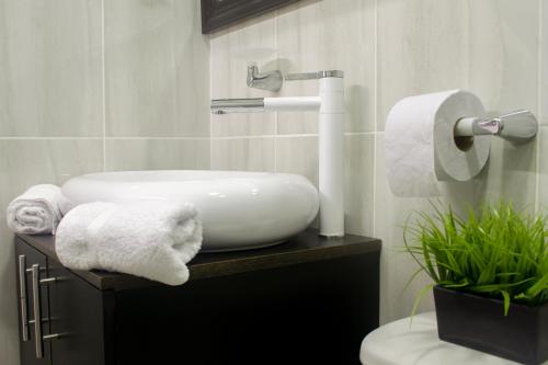 Ένα μπάνιο στο Apartahotel Kelly