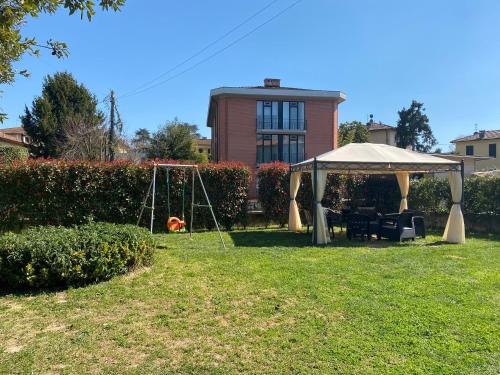 a large building with a lawn chair in front of it at Villa Catelli B&B in Lucca