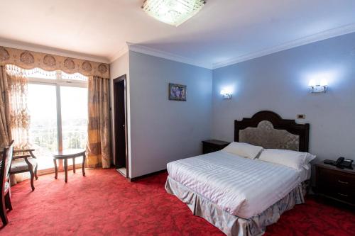 Postel nebo postele na pokoji v ubytování Ras Amba Hotel