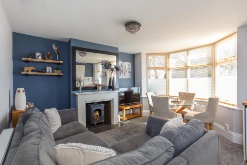 a living room with a couch and a fireplace at Queens Road 2 Bed apartments Central Richmond in Richmond