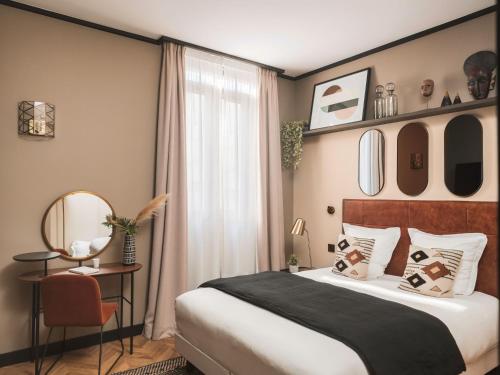 Letto o letti in una camera di Maisons du Monde Hôtel & Suites - Marseille Vieux Port