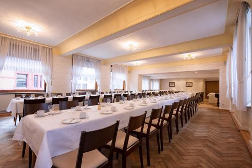a large room with a long table and chairs at Hotel-Restaurant Weinhaus Grebel in Koblenz