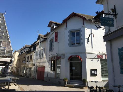 a row of buildings on a city street at Hôtel L'albatros in Le Pouliguen