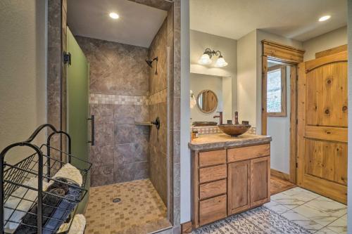 a bathroom with a shower and a sink at Lakefront Shell Knob Home with Deck and Gas Grill in Shell Knob