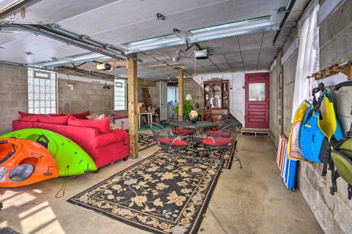 a living room with a couch and a table at Walk to Chautauqua Lake Mayville Getaway! in Mayville