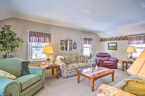 a living room with couches and chairs and a table at Walk to Chautauqua Lake Mayville Getaway! in Mayville