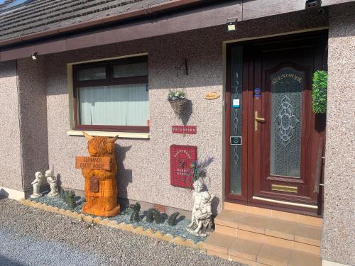 a fire hydrant on the side of a building at Gleninver Guest House in Inverness