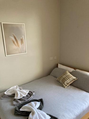 a bedroom with a bed with two towels on it at 'Bloomfield' at stayBOOM in Lancaster