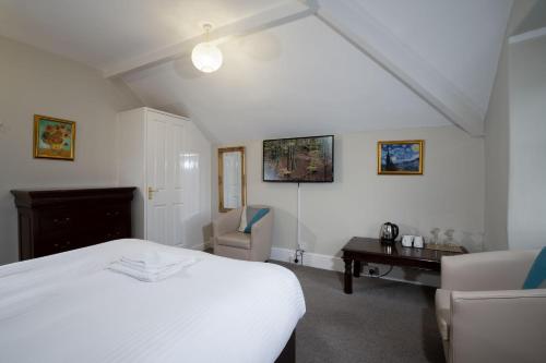Un ou plusieurs lits dans un hébergement de l'établissement Wanslea Guest House