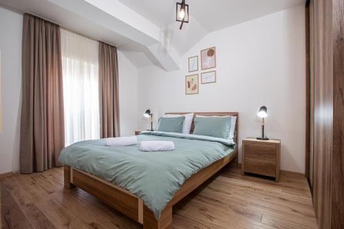 Postel nebo postele na pokoji v ubytování Rest Apartments