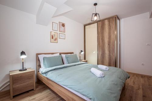 Postel nebo postele na pokoji v ubytování Rest Apartments