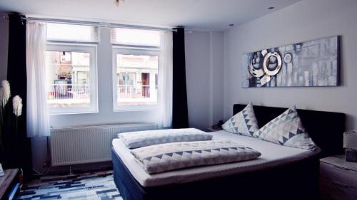 Katil atau katil-katil dalam bilik di Moderne Wohnung Schwarzwald - In bester Lage direkt am Fluss