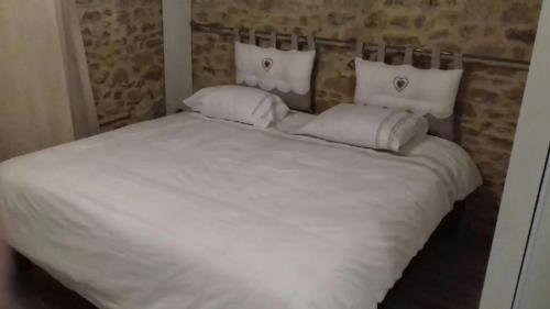 Ein Bett oder Betten in einem Zimmer der Unterkunft Gîte Les Tilleuls