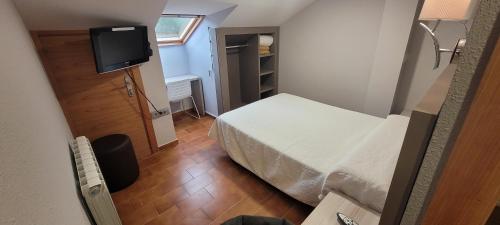 Una cama o camas en una habitación de Hotel Meson de L’Ainsa