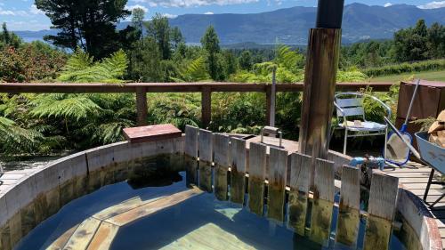 a swimming pool with a view of the mountains at Cabañas Copayapu in Pucón