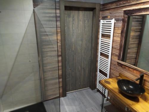 a bathroom with a sink and a mirror at La pacheca in Lazise