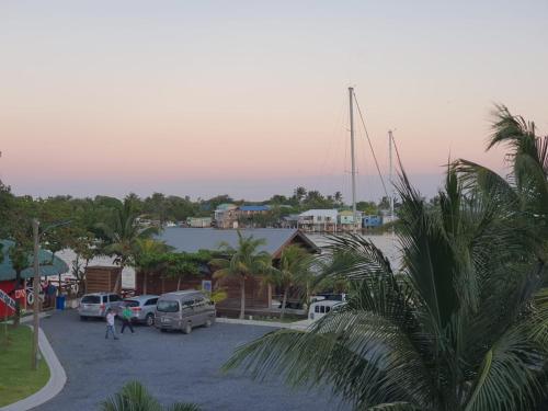 a group of cars parked in a parking lot at Hotel and Dive Center Roatan Yacht Club in Roatán