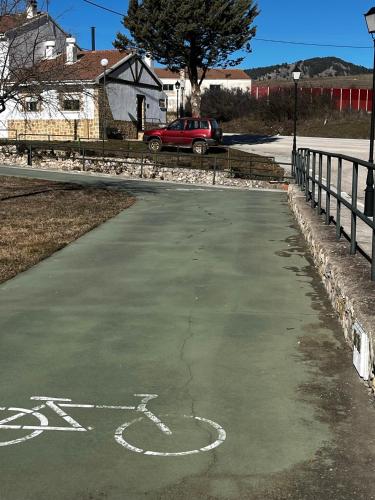 a parking lot with a bike painted on it at Casa Rural Chincha in Tragacete