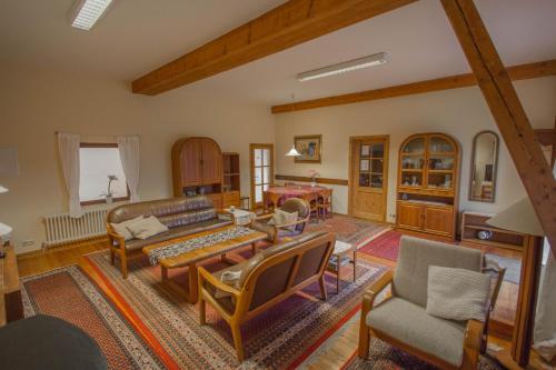 a living room with a couch and chairs at Haus Falkenhof in Knüllwald