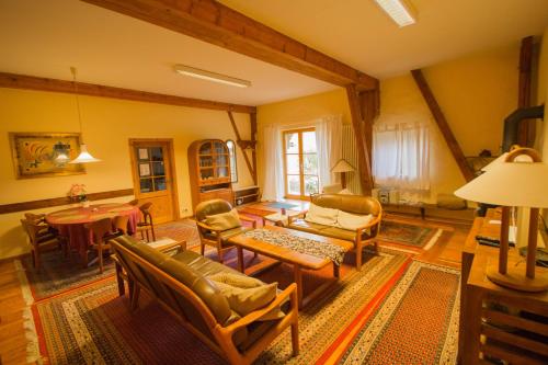 a living room filled with furniture and a table at Haus Falkenhof in Knüllwald