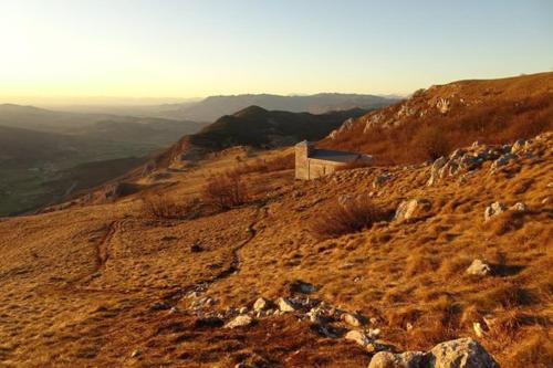 a mountain with a road on top of it at Apartma Uhanje pri Božičevih in Ajdovščina
