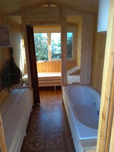 a large bathroom with a tub in a house at Agroturystyka u Wioli i Irka , apartament u Beaty in Karsin