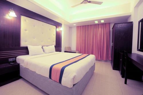 a bedroom with a large bed in a room at Cox Beach Resort in Cox's Bazar
