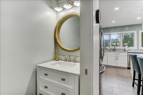 a bathroom with a sink and a mirror at Sandpiper in Fernandina Beach