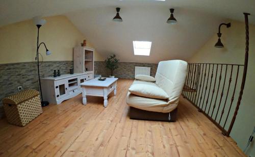 a living room with a couch and a table at Casa Rural Guadiela in San Pedro Palmiches