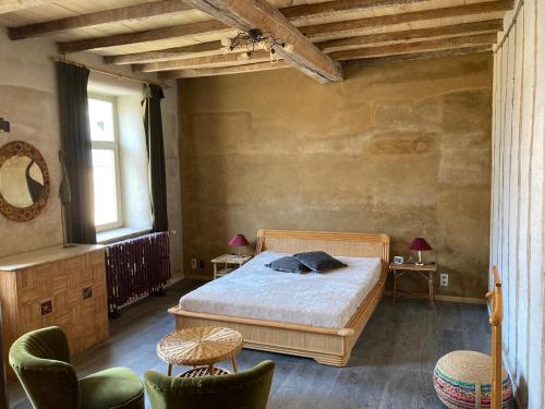 Ένα ή περισσότερα κρεβάτια σε δωμάτιο στο La Cure de Noduwez