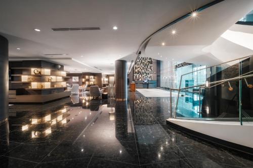 a room with a lobby with a glass wall at Paradox Vancouver in Vancouver