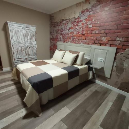 Ένα ή περισσότερα κρεβάτια σε δωμάτιο στο Hostal Pabellón