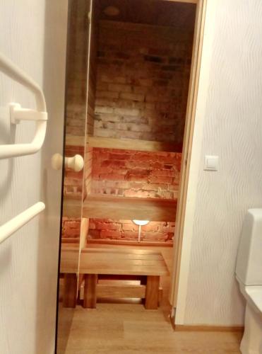 a secret staircase in a room with a wooden floor at TäheMaja5 in Viljandi