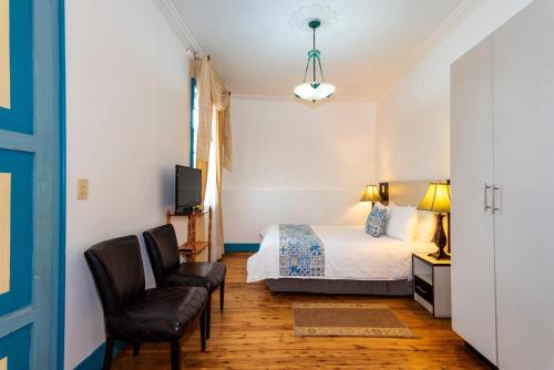 Del Parque Hotel & Suitesにあるベッド