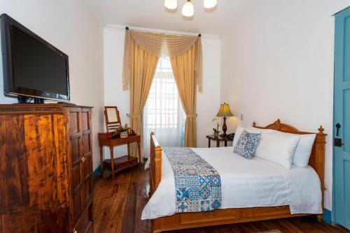 Del Parque Hotel & Suitesにあるベッド
