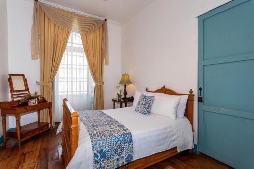 Del Parque Hotel & Suitesにあるベッド