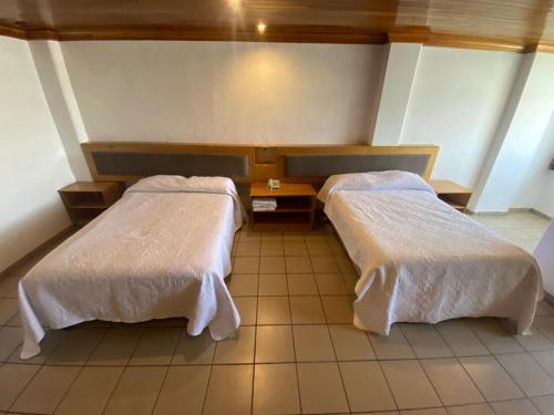 Cama o camas de una habitación en Hotel Rio Inn