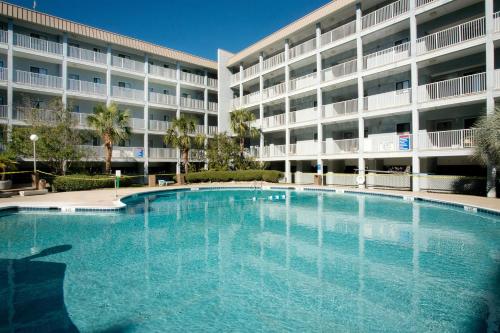 a large swimming pool in front of a building at Hilton Head Resort IV in Hilton Head Island