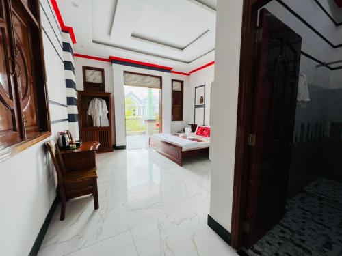 a living room with red and white stripes on the walls at Đại Quang Hotel in Can Tho