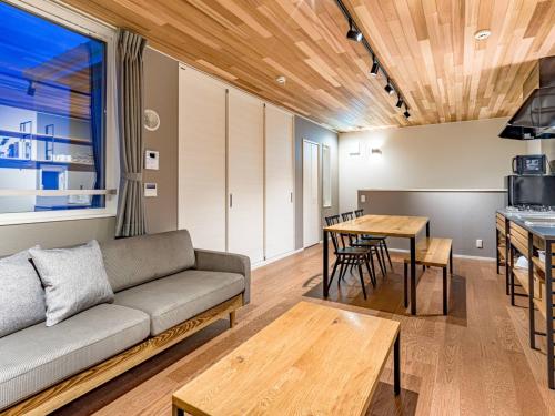 a living room with a couch and a table at Rakuten STAY HOUSE x WILL STYLE Takasaki 103 in Takasaki