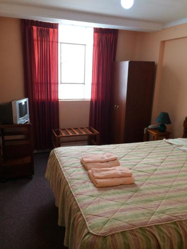Una cama o camas en una habitación de Posada Don Giorgio