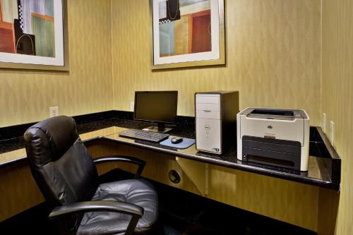 an office with a desk with a computer and a printer at Holiday Inn Express Hotel & Suites Woodhaven by IHG in Woodhaven