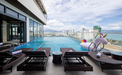 a swimming pool with a unicorn infront of a building at Miracle Luxury Nha Trang in Nha Trang