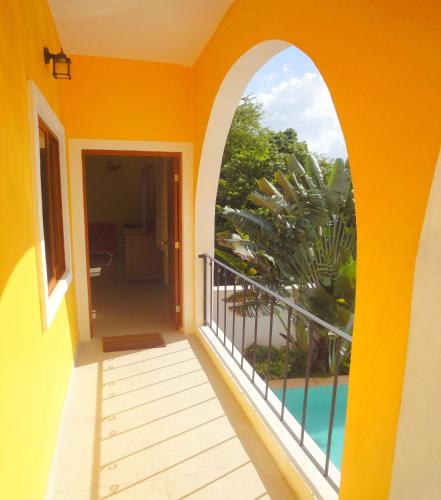 a balcony with a view of a swimming pool at Merida Santiago Hotel Boutique in Mérida
