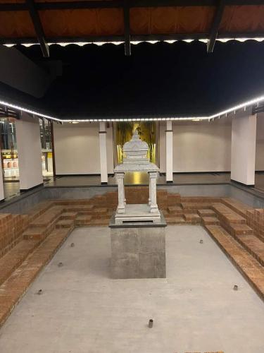 a large room with a statue in the middle of it at GReaT Trails Wayanad by GRT Hotels in Wayanad