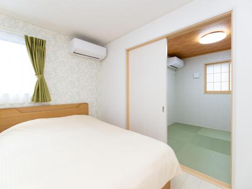 Kinugawa Station Front room A tesisinde bir odada yatak veya yataklar