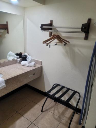 a bathroom with a towel rack hanging from the ceiling at Econo Lodge Inn & Suites in San Antonio