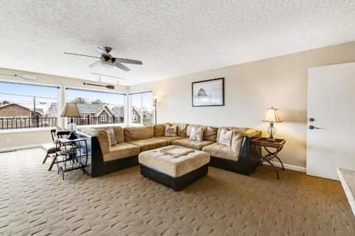 a living room with a couch and a table at Driftwood in Cannon Beach