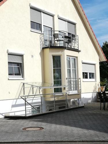 a building with a balcony on the side of it at Ferienwohnung am Bodensee mit 3 Schlafzimmer über 2 Etage mit kleine Balkon bis 6 Personen in Überlingen